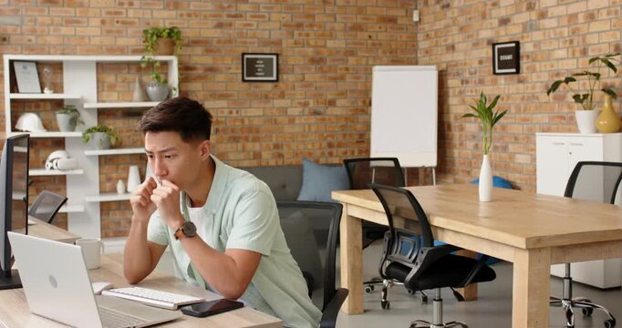 Lifestyle videos indoor of people doing activities at office, stretching at desk, man taking break f