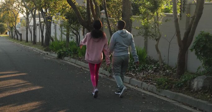 Lifestyle videos outdoor of people doing activities, jogging together, two people in athletic wear e