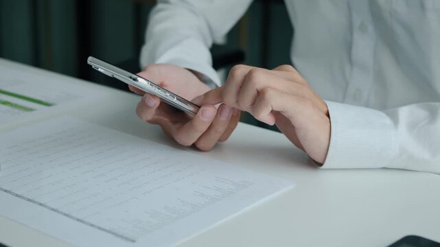Business man using smartphone while working  in office