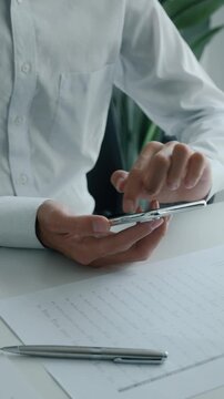 Business man using smartphone while working  in office