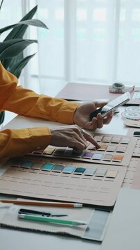 Atelier fashion designer choose  materials and fabric sample