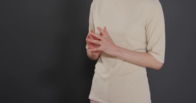 Close up of people talking to the camera, gesturing, woman in beige top giving presentation