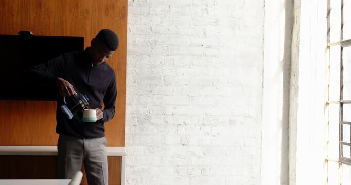 Lifestyle videos indoor of people doing activities at office, taking break, businessman drinking cof