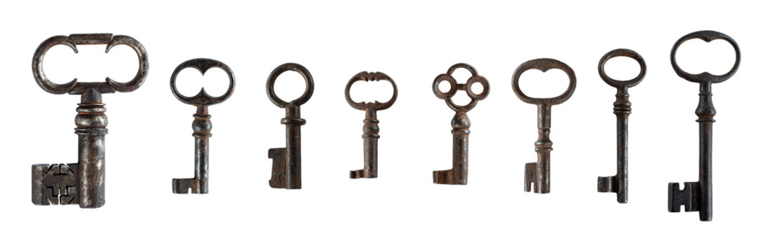 Collection of antique decorative keys with ornate bows and aged metal surfaces, isolated on a white background. Vintage historical keys suitable for  interior designand decorative projects.