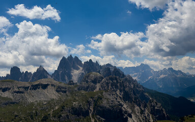Obraz premium Mountain landscape panorama Tre Cime Mount against a blue summer background. 