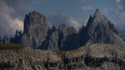 Obraz premium Mountain landscape panorama Tre Cime Mount against a blue summer background. 