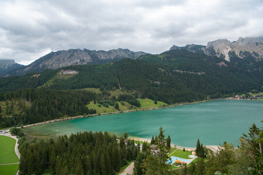Scenic view of Haldensee lake with turquoise water and alpine mountains in Austria