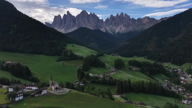 Landscape village Santa Maddalena in mountain valley at sunset in Dolomites, Italy. St. Magdalena and mountains. Val di Funes 