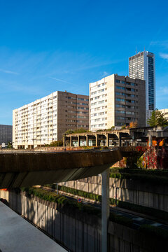 Contemporary residential and office buildings in Paris, France, viewed across layered urban structures in a modern city environment.