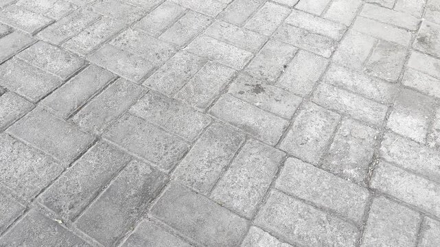 High angle view of classic rectangular paving stone sidewalk