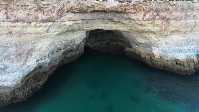 Aerial view of rocky coastal formations above turquoise sea in Portugal. Algarve. Beach 