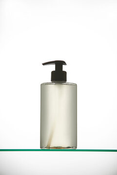 Clear Shower Gel Pump Bottle on Glass Shelf