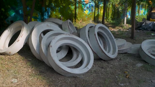 Concrete Drainage Rings in a Wooded Storage Area