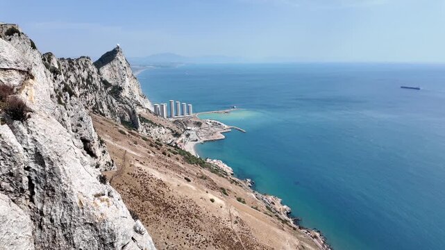 Dramatic cliffside view of the Rock of Gibraltar and coastal sea