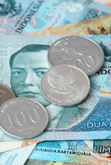 Indonesian rupiah money bills and coins on table. Indonesia cash of IDR currency © Larysa