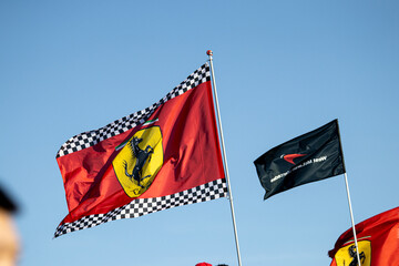 Fototapeta premium 24 May 2026, Montreal, Canada: Ferrari flags wave above Formula 1 fans at Grand Prix weekend. g.