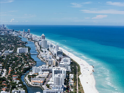 defaultStormy aerial view of Miami Beach shoreline under dark clouds. g.