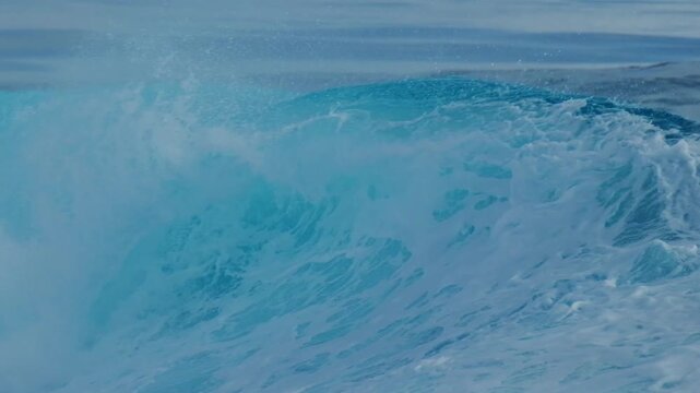 Ocean wave rolls and breaks in the Maldives