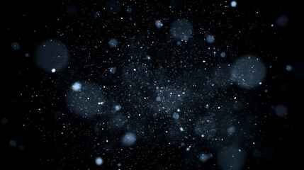 Obraz premium Abstract background of floating snow dust and frozen particles. Glowing white and blue winter bokeh effect on a black background. Icy particle field overlay.