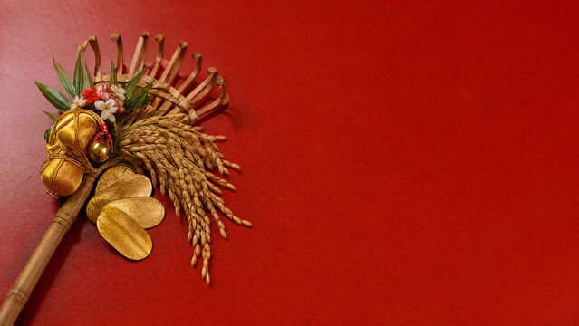 Decorated kumade rake charm for Japanese tori no ichi on vermilion