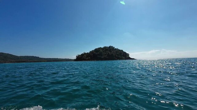 Shallow tropical shoreline with calm blue water