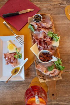 Elegant aperitivo being served in Italy restaurant setting.