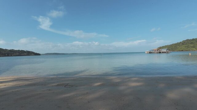 Wooden waterfront structure beside calm tropical sea