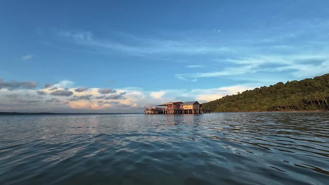 Floating waterfront restaurant on tropical bay