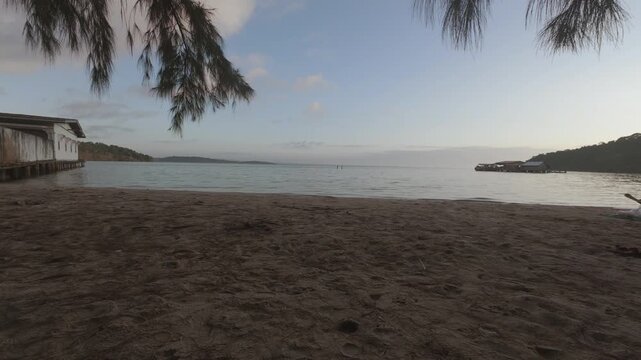 Quiet tropical beach shoreline at low tide
