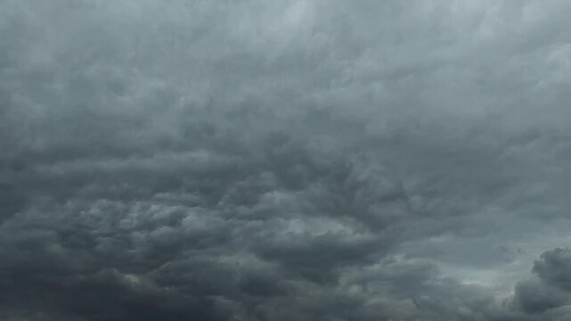 Dark stratocumulus clouds of storm moving in the sky