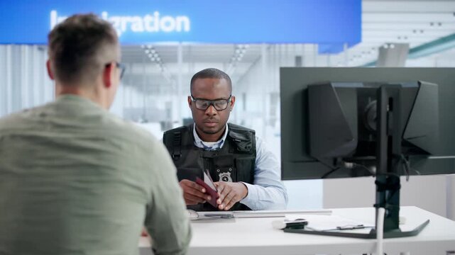 Security Officer Verifies Man&rsquo;s Passport Using Computer
