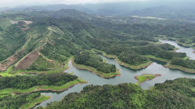 Aerial view of Ta Dung Lake with green hills in Dak Nong, central Vietnam.