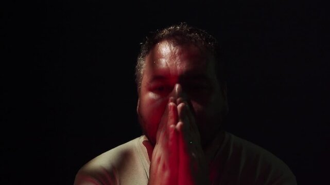 A man is sad in the dark