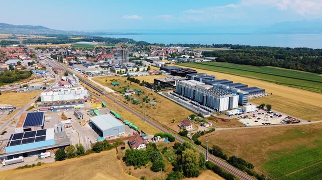 Drone orbits data center infrastructure overlooking Lake Geneva Switzerland
