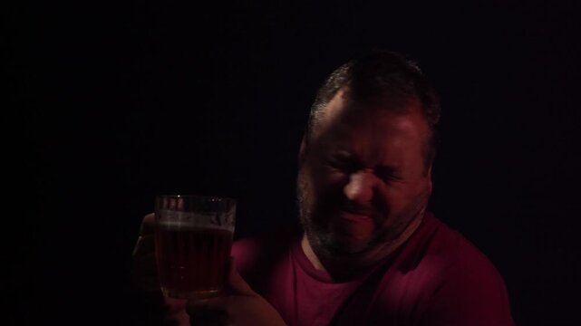 Sad  man lonely in pub drinking beer.