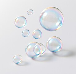 Obraz premium Colorful soap bubbles floating against white background