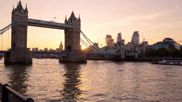 Tower Bridge and River Thames Waterfront at Sunset with City Buildings Background