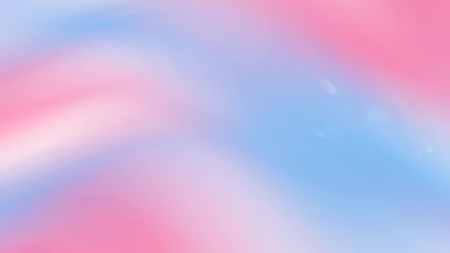 Soft pastel pink and blue colors seamlessly blending forming a calming and gentle gradient surface for designs and concepts.