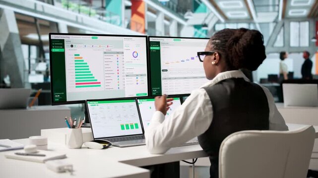 Environmental Analyst Uses Laptop To Track Carbon Emissions