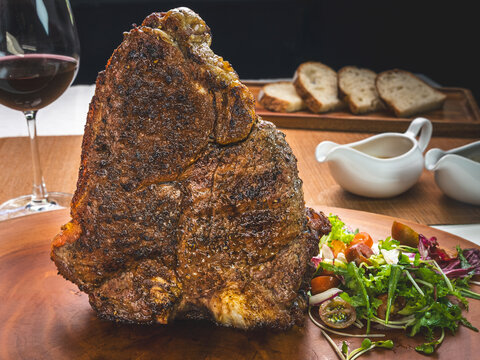 Crispy breaded meat cutlet served with side dishes