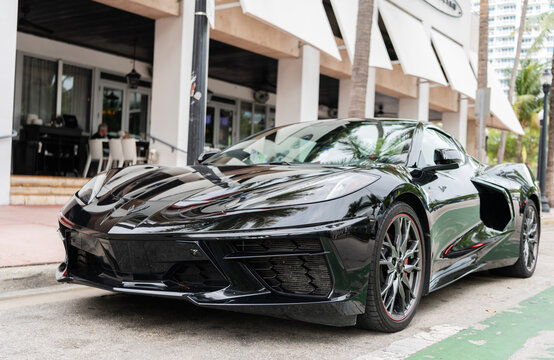 Miami, Florida, USA - May 05, 2025: Chevrolet Corvette C8 2023 sports car. Luxury sport car Chevrolet Corvette. Car Chevrolet Corvette parked outdoor. Black Chevy sportscar, corner view