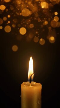金のキャンドルの炎とボケ 黒背景ループ動画