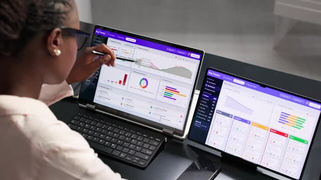 Software Developer Woman Reviewing Bug Reports On Laptop