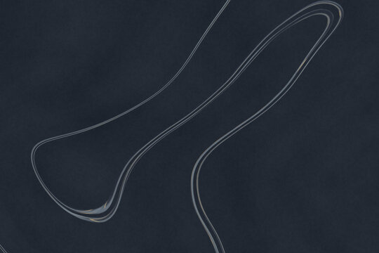 Abstract curved lines with glossy sheen on dark background