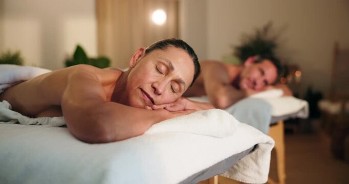 Relax, woman and sleeping on massage table for couple spa, muscle comfort and luxury self care. Hospitality, mature client and resting for post body pamper, healing therapy and duo treatment package