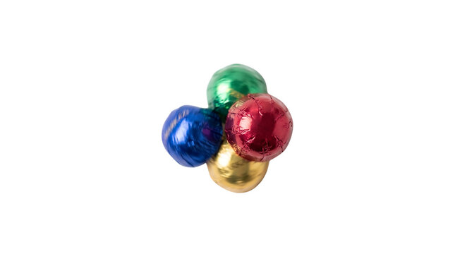 Colorful foil wrapped chocolates clustered together on transparent background