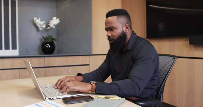 Lifestyle videos indoor of people doing activities at office, typing on laptop, male business profes