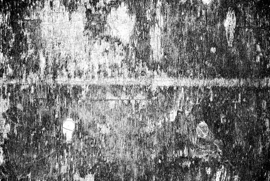 Black and white grunge texture of old damaged wood with weathering and scratches.