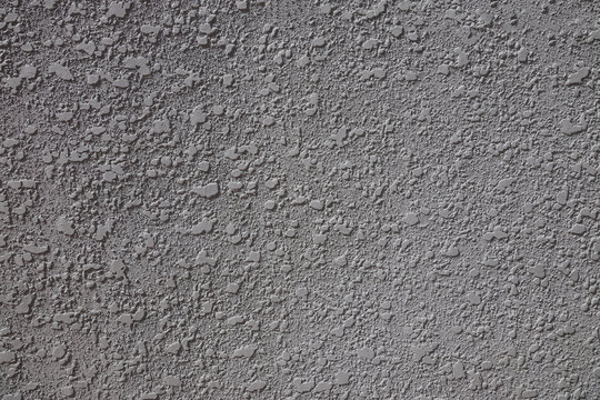 Grey knockdown stucco texture wall with shadow