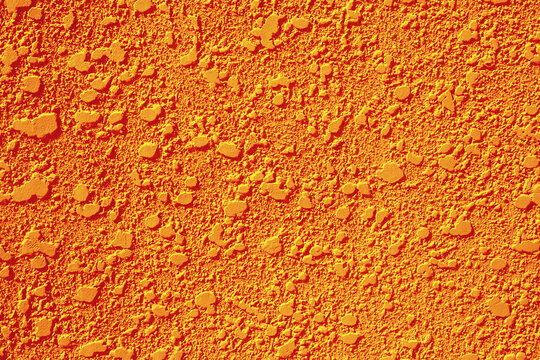 Bright orange knockdown stucco wall texture